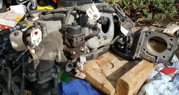 Removing throttle body from intake manifold for cleaning
